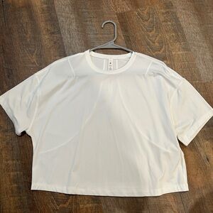 White Lulu lemon short sleeve abrasion-resistant training shirt.
